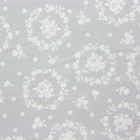Grijs met witte medaillons van bloemen